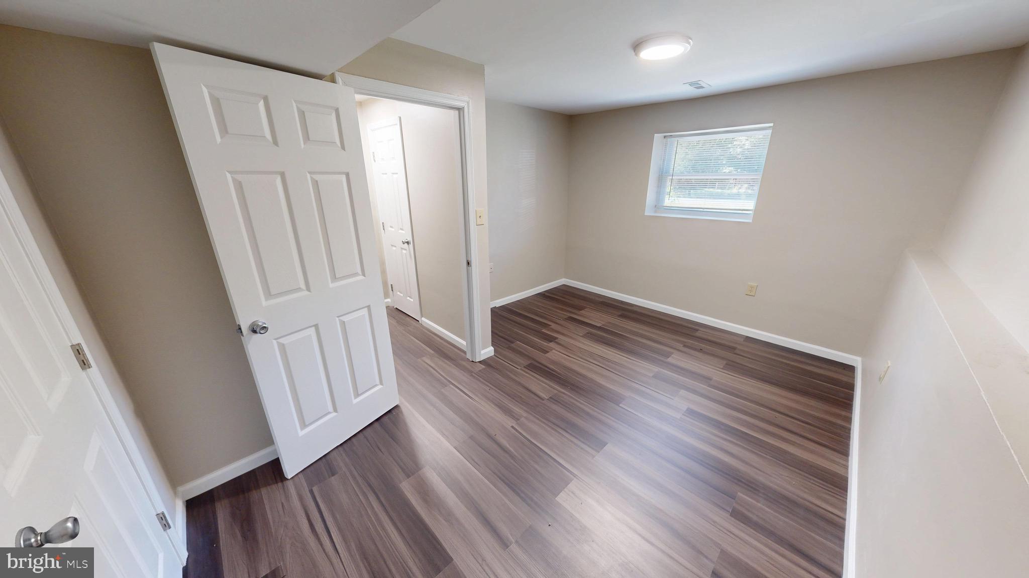 12820 Twin Oak Drive Waldorf, MD 20601 - Photo 64 of 98 wooden floor in an empty room with a window
