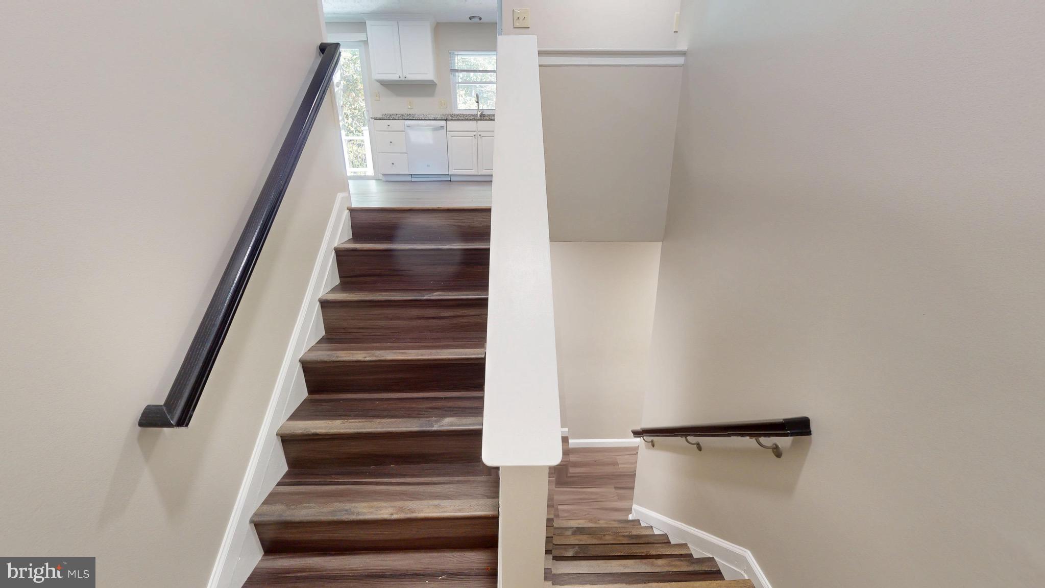 12820 Twin Oak Drive Waldorf, MD 20601 - Photo 7 of 98 a view of entryway and gallery with wooden floor