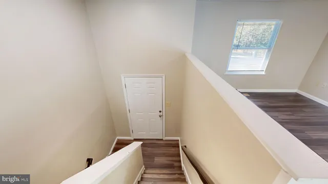 a view of a hallway with windows