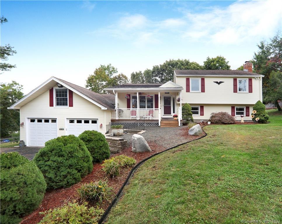 159 Cook Hill Road Wallingford, CT 06492 - Photo 1 of 1 a front view of a house with a yard table and chairs