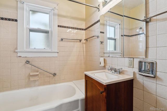 a bathroom with a sink and a bathtub