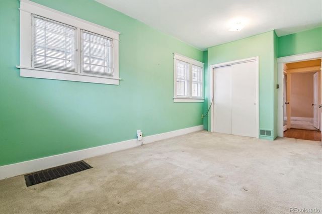 an empty room with windows