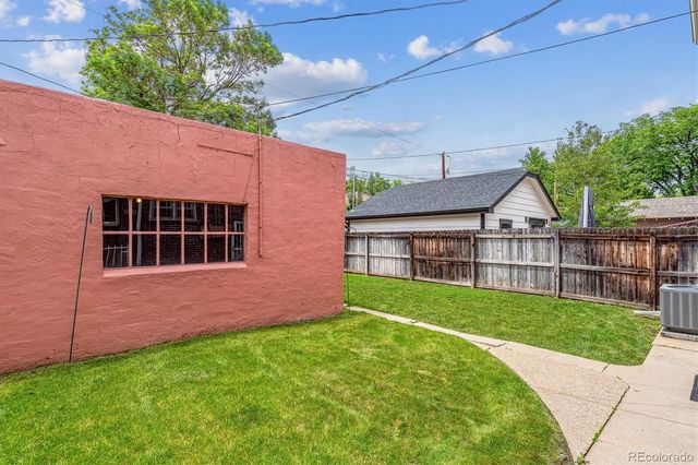 a view of backyard with small garden