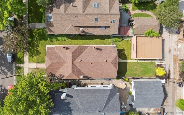 an aerial view of a house with yard swimming pool and outdoor seating