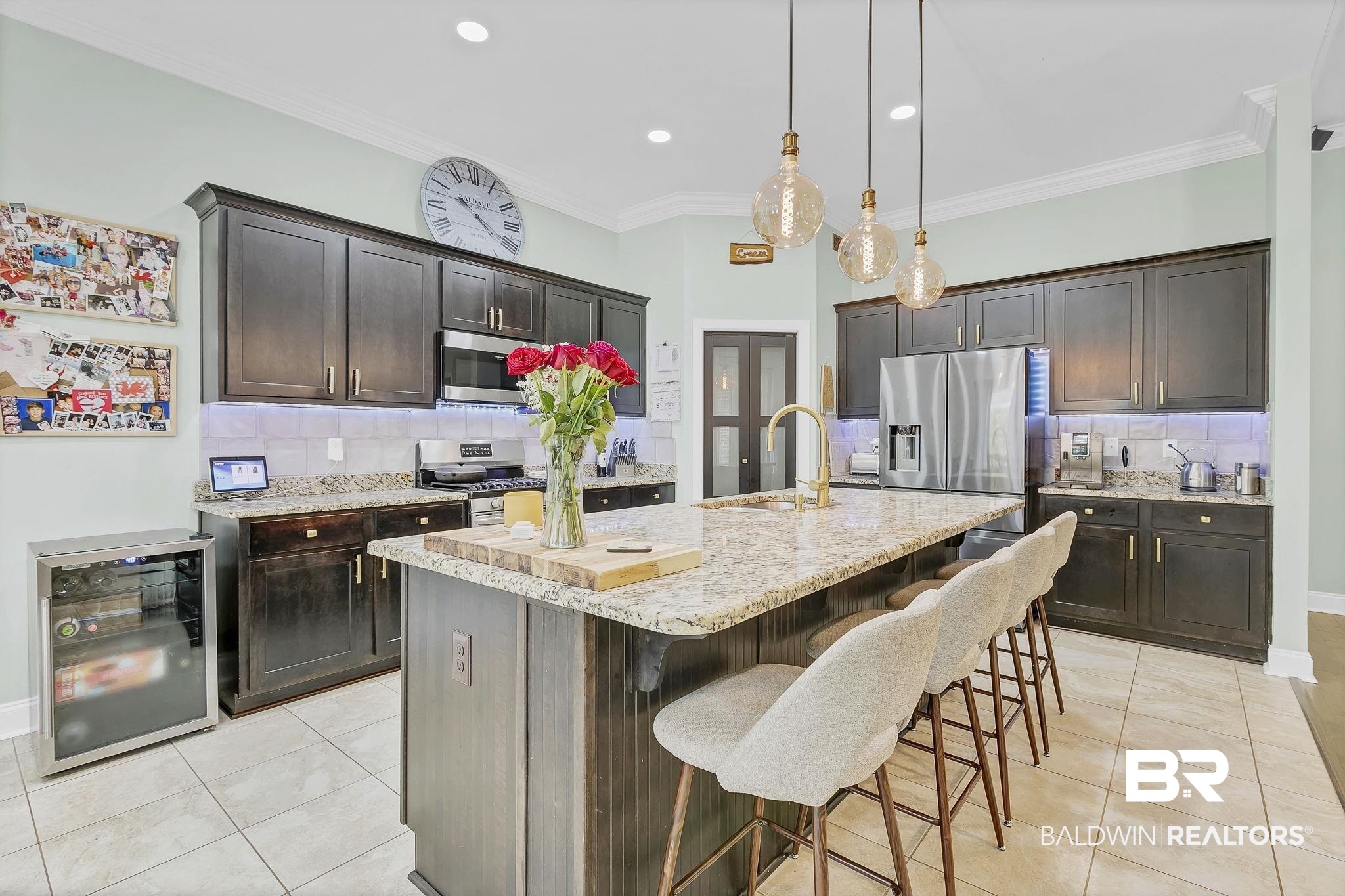 30635 Drayton Court Daphne, AL 36527 - Photo 14 of 51 Kitchen featuring beverage cooler, a sink, stainless steel appliances, light tile patterned flooring, and decorative backsplash