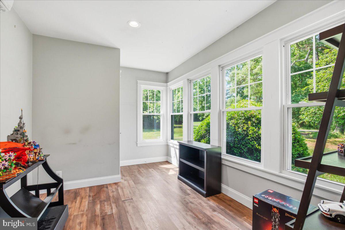 16146 Thomas Road Piney Point, MD 20674 - Photo 21 of 70 a very nice looking room with wooden floor and walls