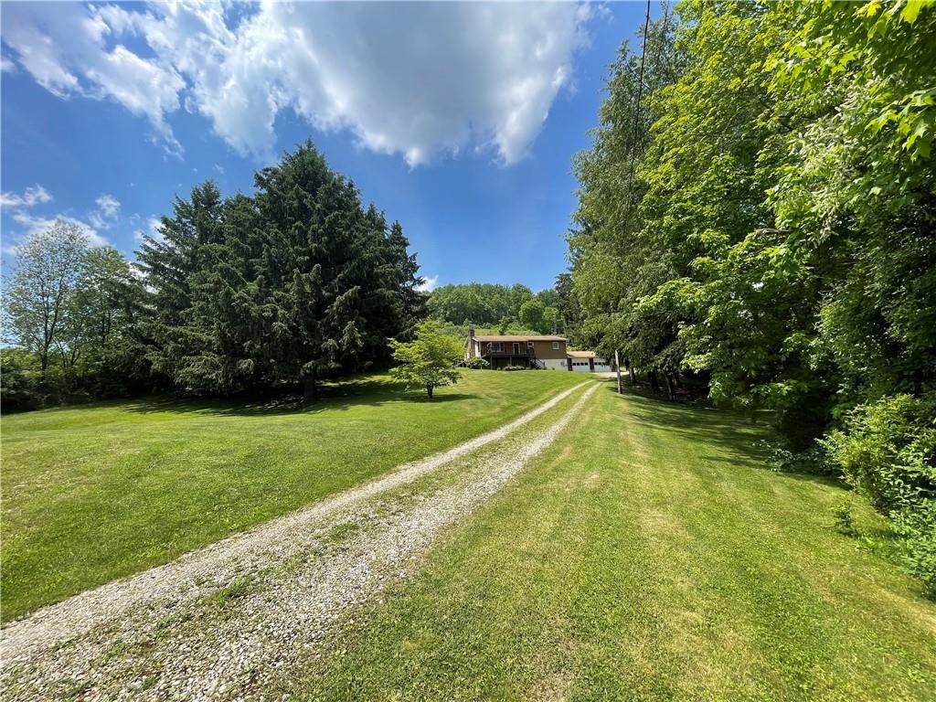 867 Ambrose Road Home, PA 15747 - Photo 6 of 17 a view of a yard with a house