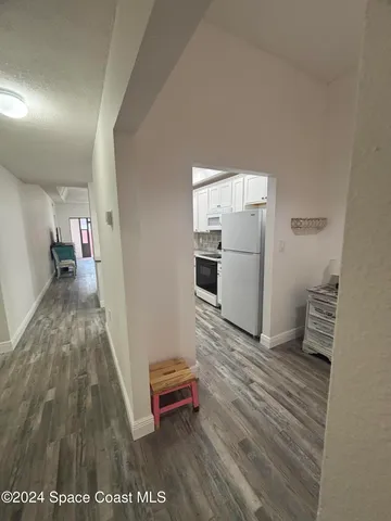 a living room with a wooden floor