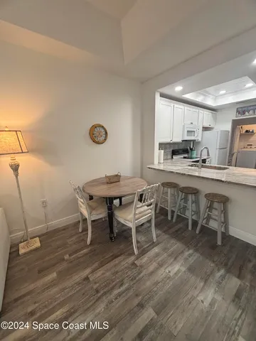 a view of a dining room with furniture and a table