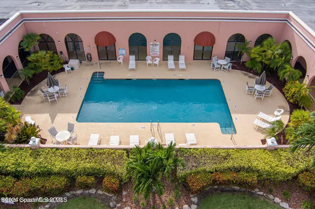 a view of swimming pool with a outdoor seating