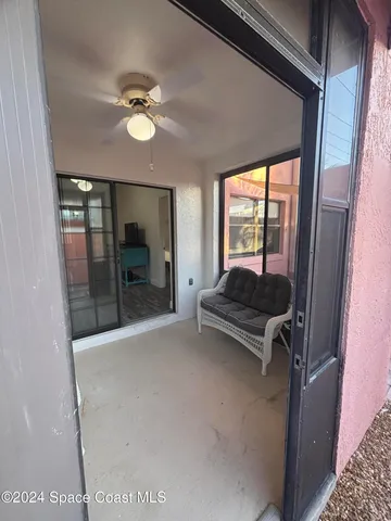 a view of a livingroom with furniture and a window