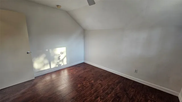 a view of an empty room and a window