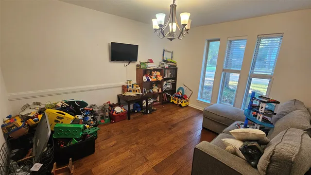 a view of a livingroom with furniture and toys