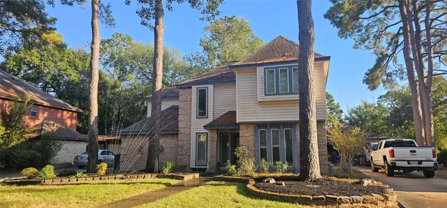 a front view of a house with swimming pool and porch
