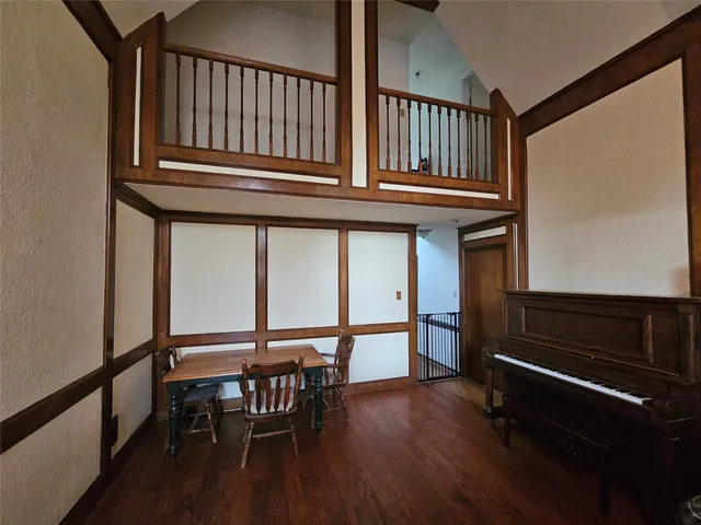 a view of a livingroom with furniture and hardwood floor