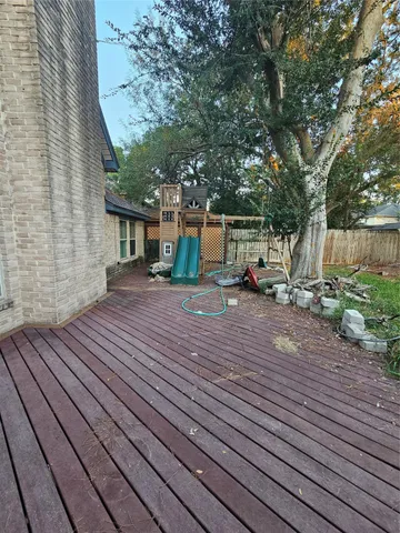 a view of a house with backyard porch and sitting area