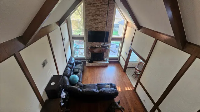 a view of living room with furniture and a mirror