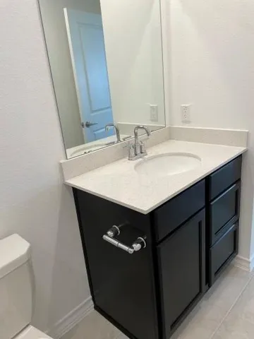 a kitchen with wooden cabinets and a stove top oven
