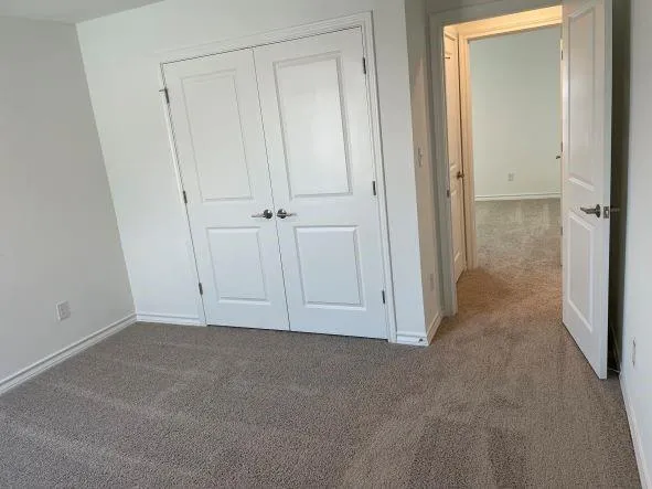 a large kitchen with kitchen island a sink a stove a refrigerator and grass with wooden floor