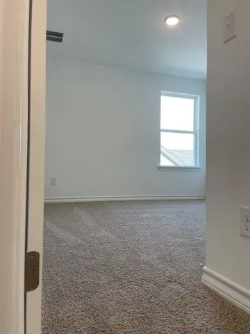 a kitchen with granite countertop a stove a sink and a microwave