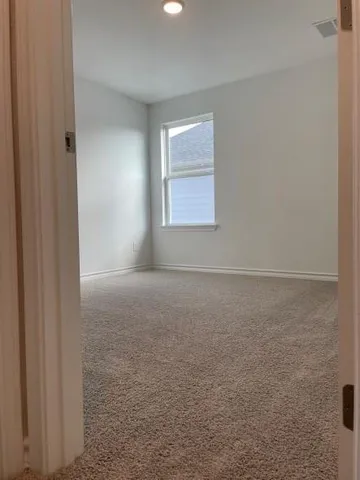 a kitchen with a sink cabinets and wooden floor