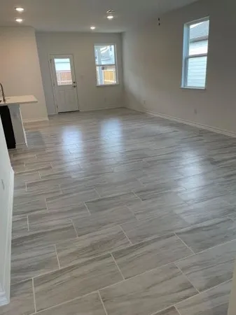 a view of a hallway with a kitchen