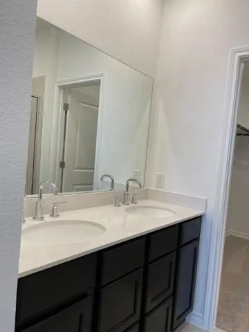 a bathroom with a glass shower door