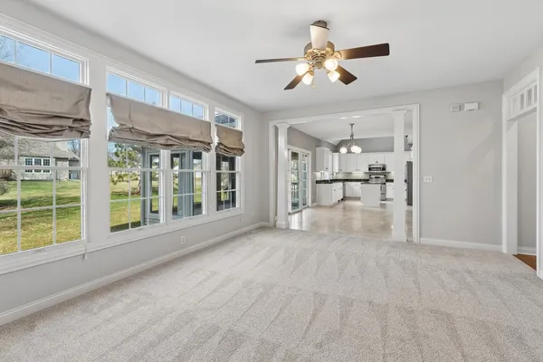 a kitchen with granite countertop stainless steel appliances a refrigerator a sink a stove a microwave and cabinets