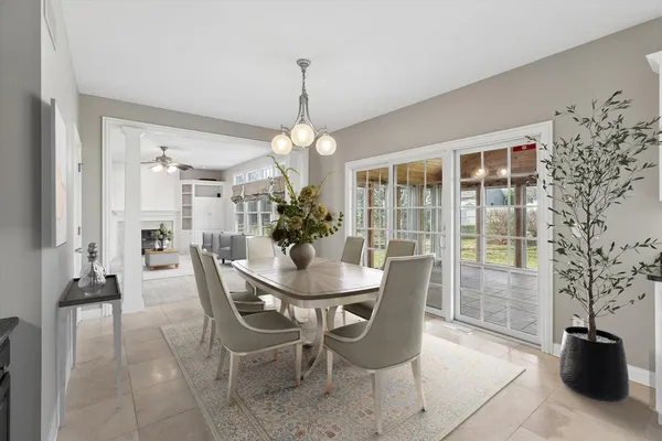a kitchen with granite countertop a refrigerator stove and microwave