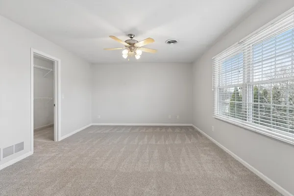a view of hallway with wooden floor
