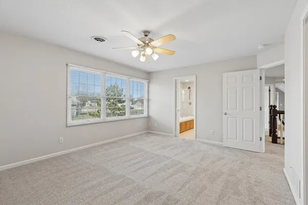 a view of hallway with stairs and a couch