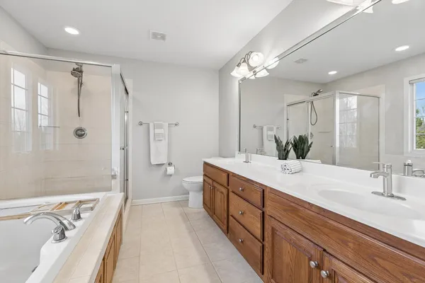 a view of an empty room with a fireplace and cabinet