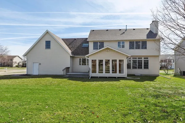 a house that has a big yard in front of it
