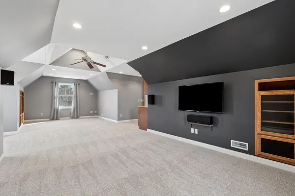 a kitchen with stainless steel appliances granite countertop a stove a refrigerator and a microwave