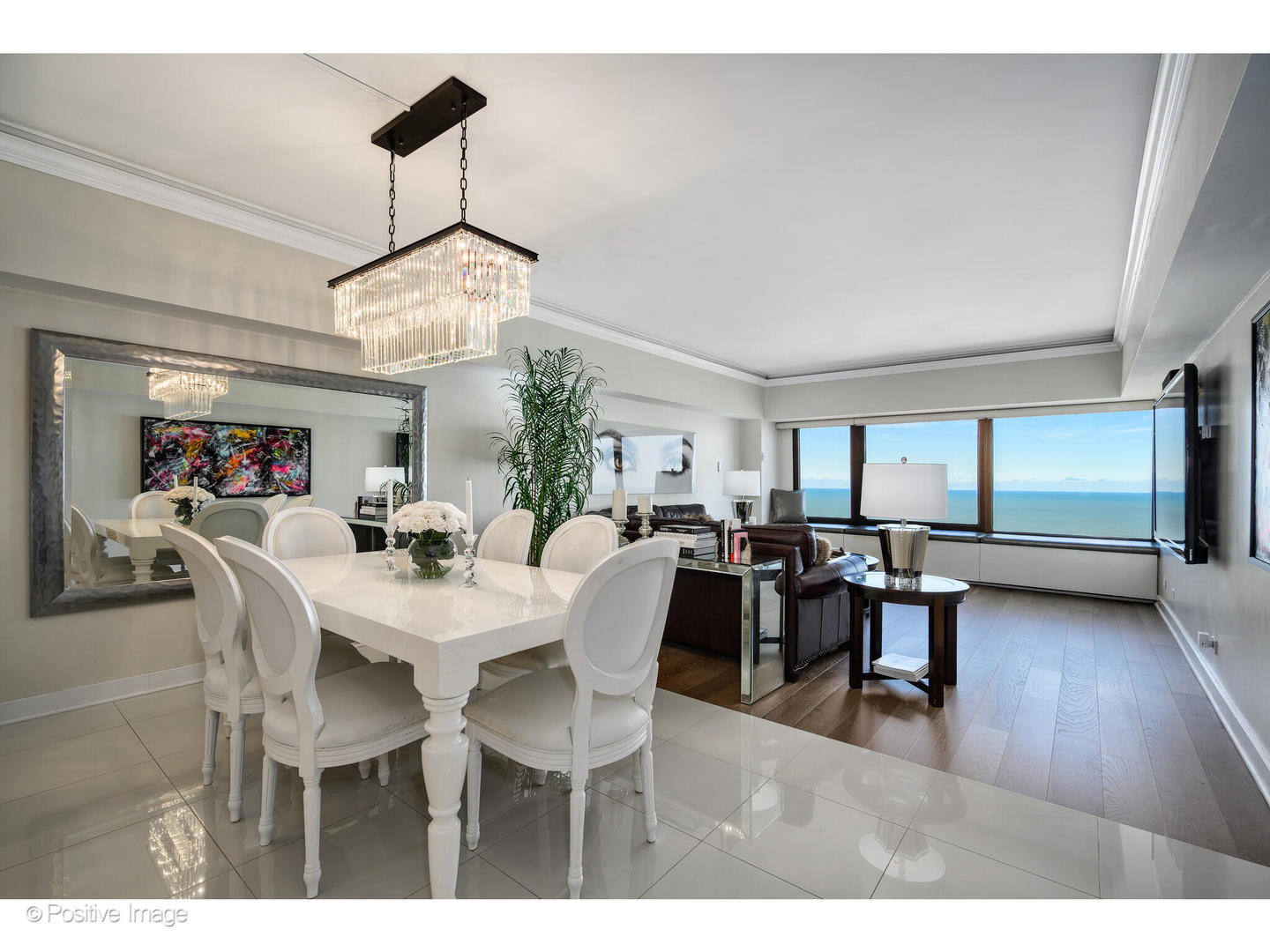 175 East Delaware Place, Unit 7107 Chicago, IL 60611 - Photo 2 of 24 a view of a dining room with furniture window and wooden floor
