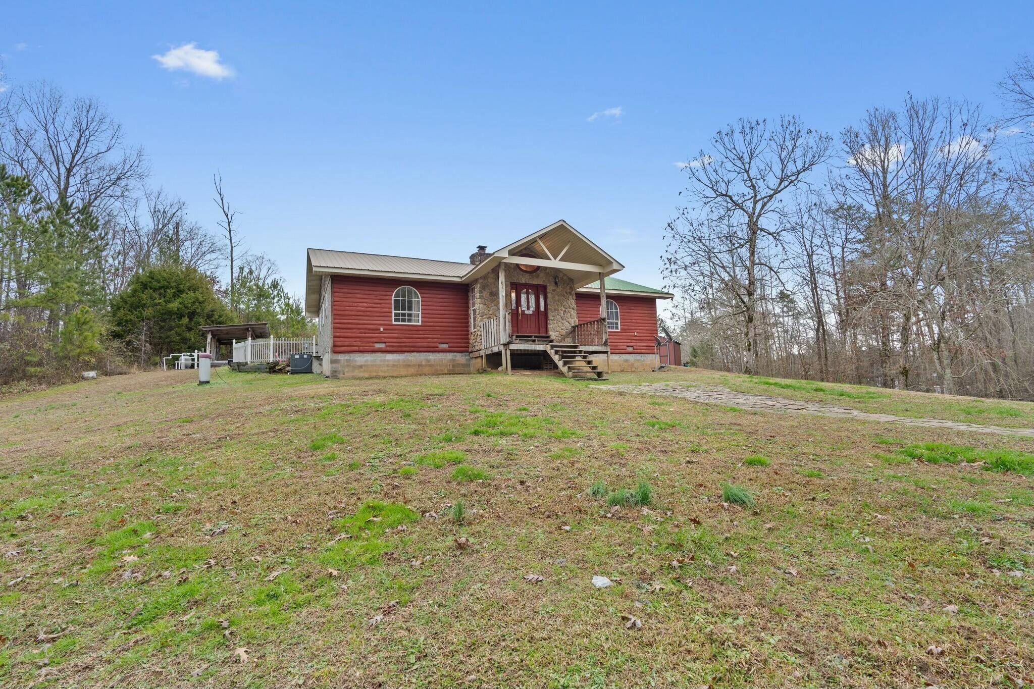 362 Carson Road Southeast Cleveland, TN 37323 - Photo 3 of 24 a front view of a house with a yard and garage