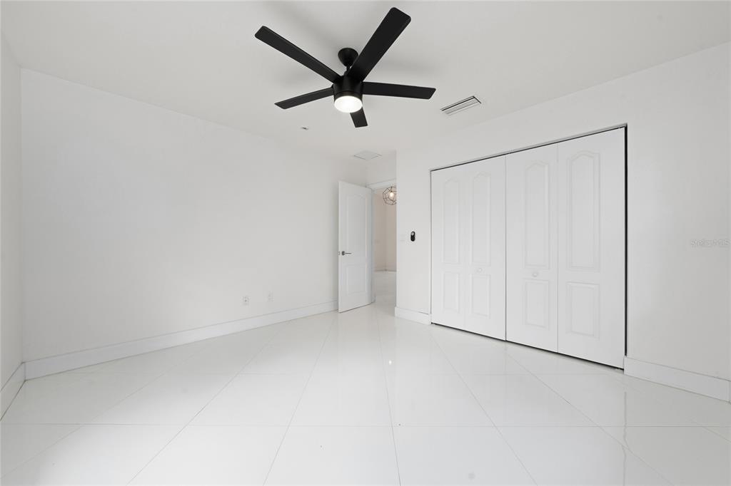 11036 Bronson Road Clermont, FL 34711 - Photo 17 of 29 a view of room with a ceiling fan