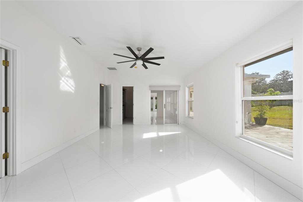 11036 Bronson Road Clermont, FL 34711 - Photo 10 of 29 a view of a livingroom with a ceiling fan and window