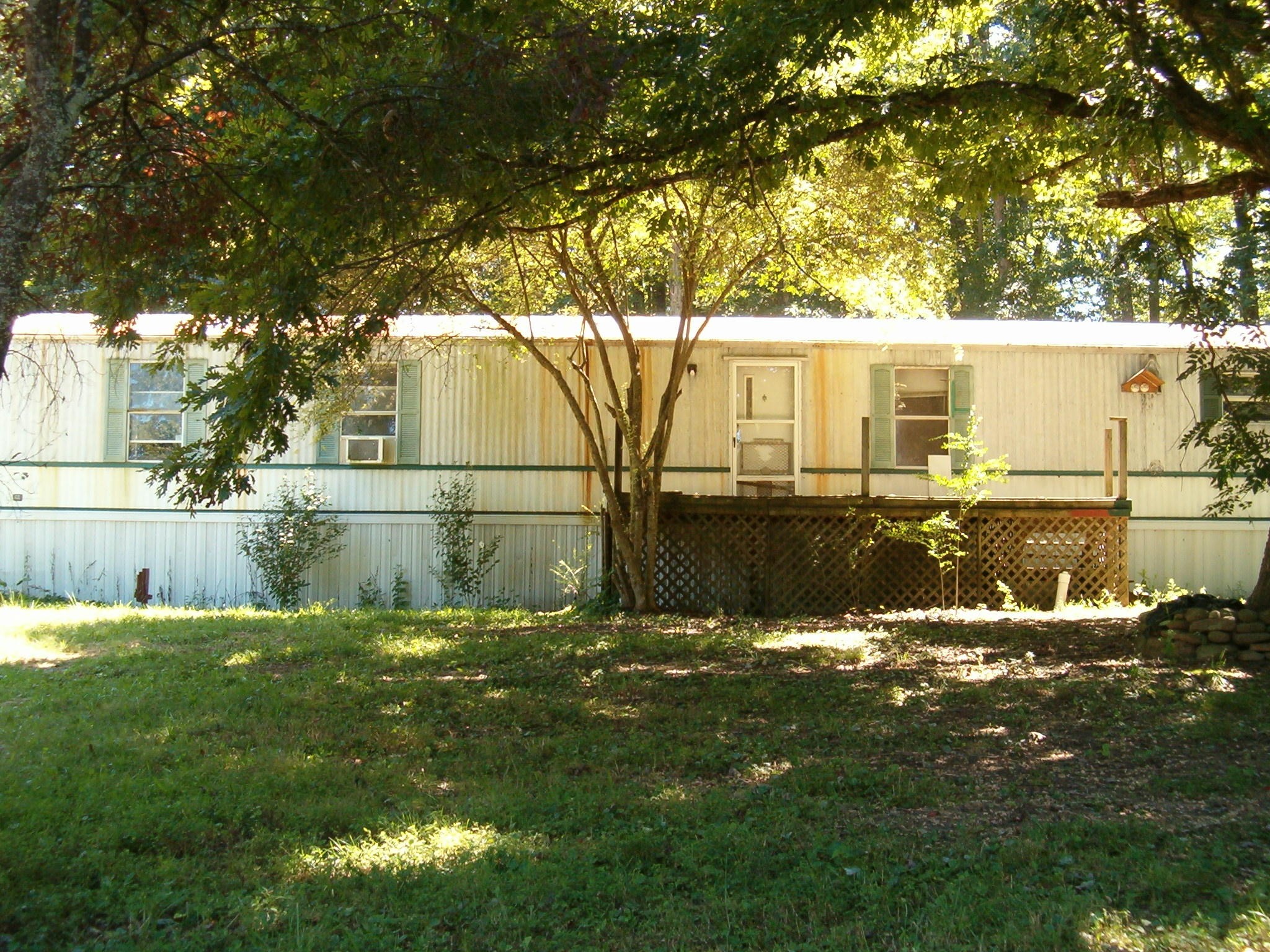 a backyard of a house with lots of green space