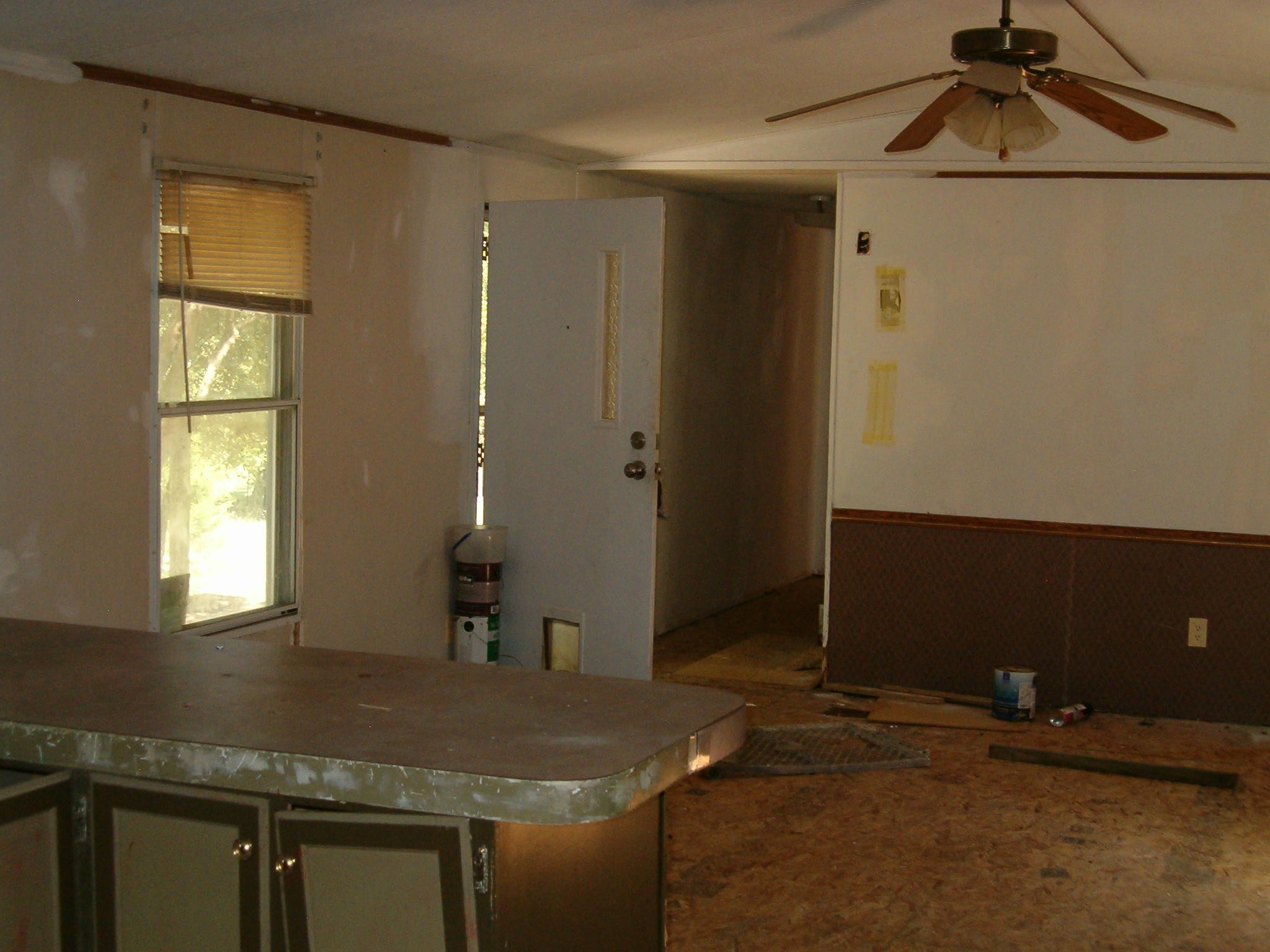 1021 Maple Grove Road Ten Mile, TN 37880 - Photo 7 of 8 a kitchen with a sink cabinets and a window