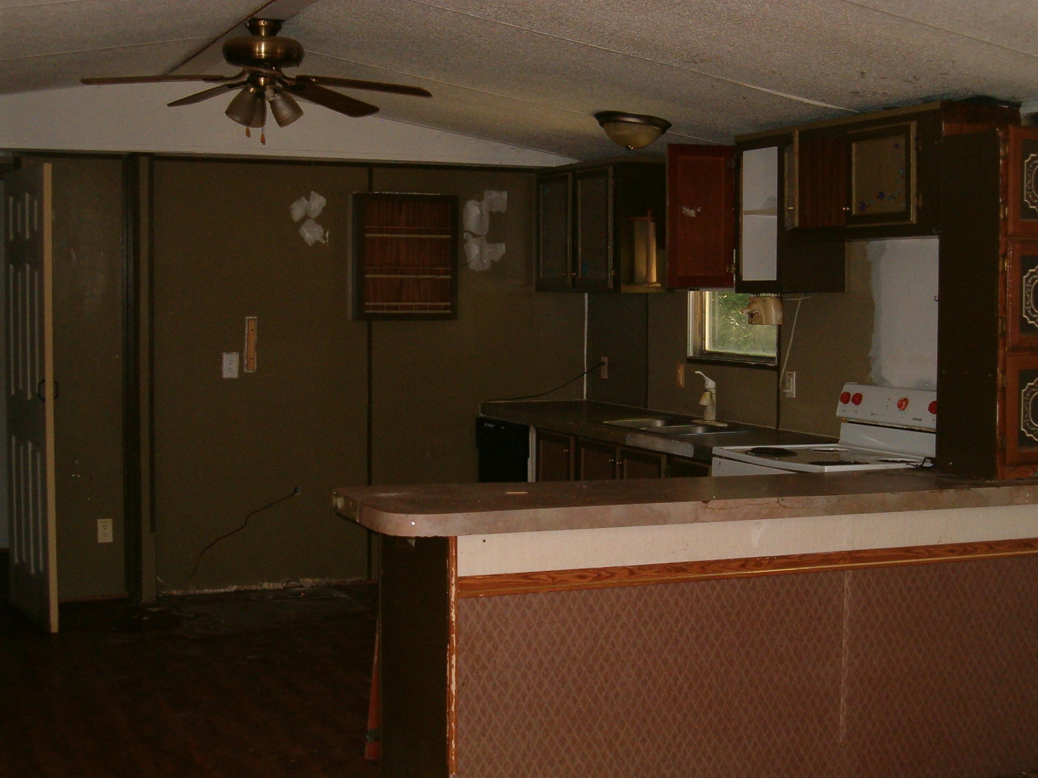 1021 Maple Grove Road Ten Mile, TN 37880 - Photo 8 of 8 a kitchen with a sink a refrigerator and cabinets