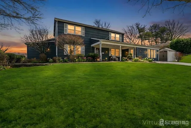 a view of a big yard of front a house
