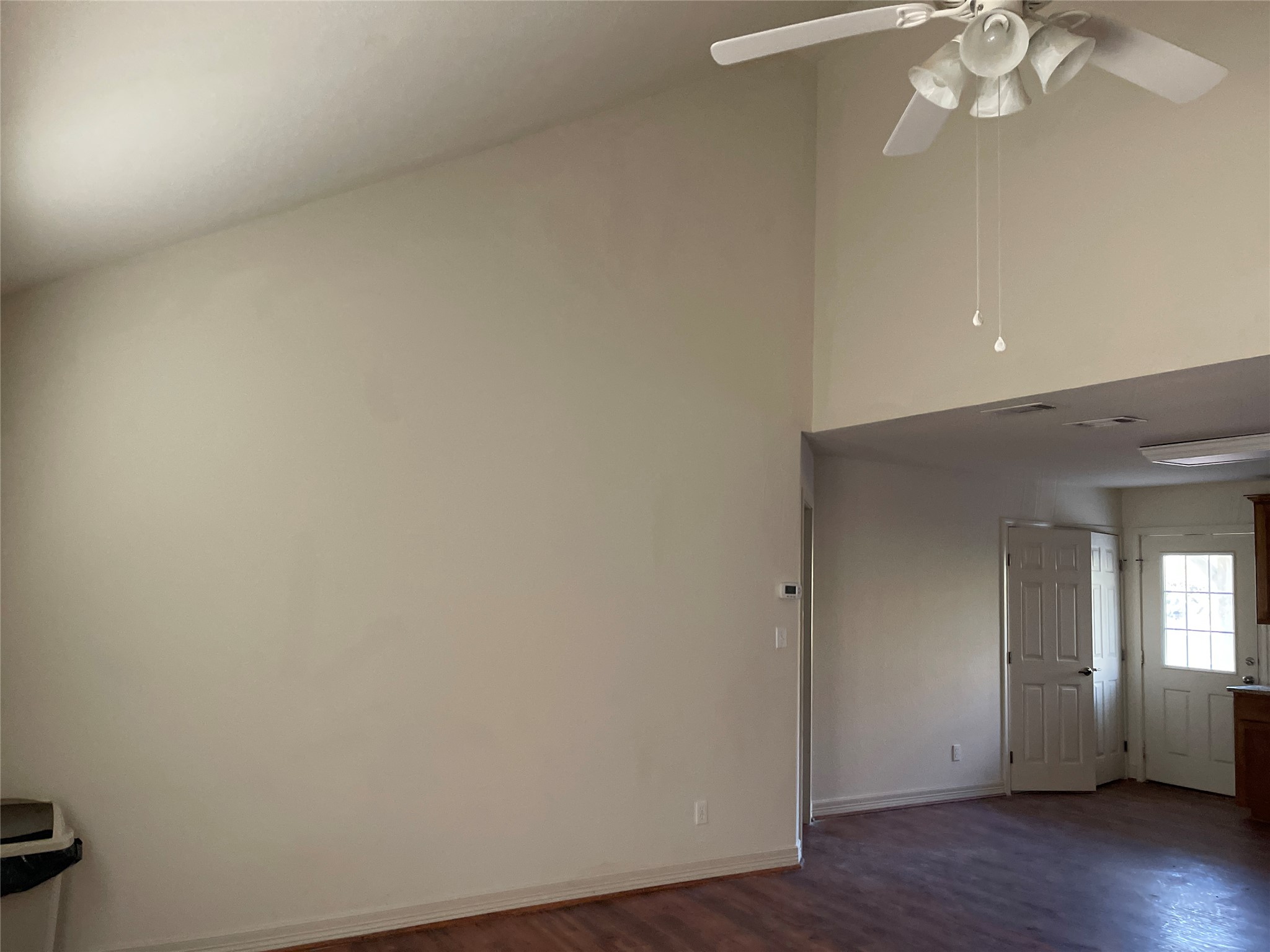 6164 South Fm 535 Road Cedar Creek, TX 78612 - Photo 11 of 27 an empty room with wooden floor and windows