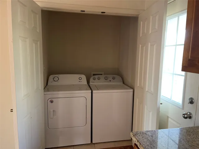 a utility room with dryer and washer