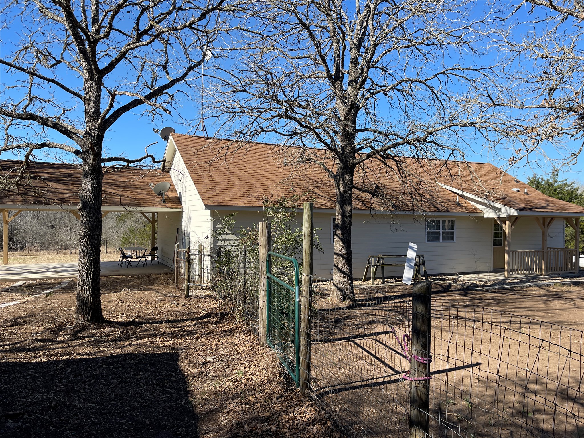 6164 South Fm 535 Road Cedar Creek, TX 78612 - Photo 18 of 27 a view of a house with backyard and a tree