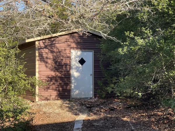 a view of a house with a tree