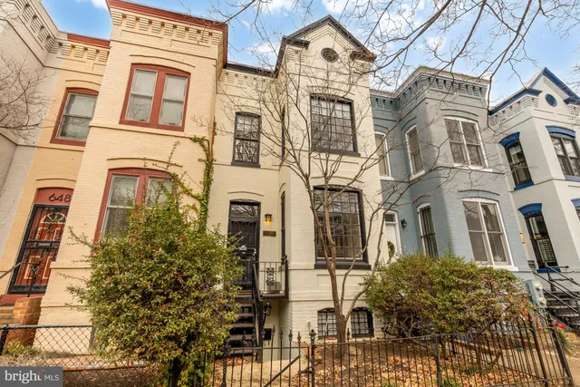 a front view of a multi story residential apartment building
