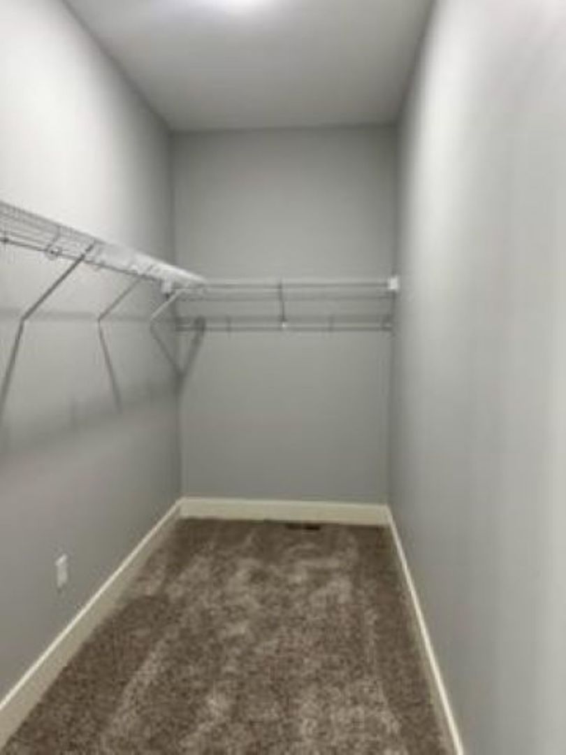 634 Anjali Court, Unit R Sycamore, IL 60178 - Photo 14 of 20 a view of a room with racks on the wall