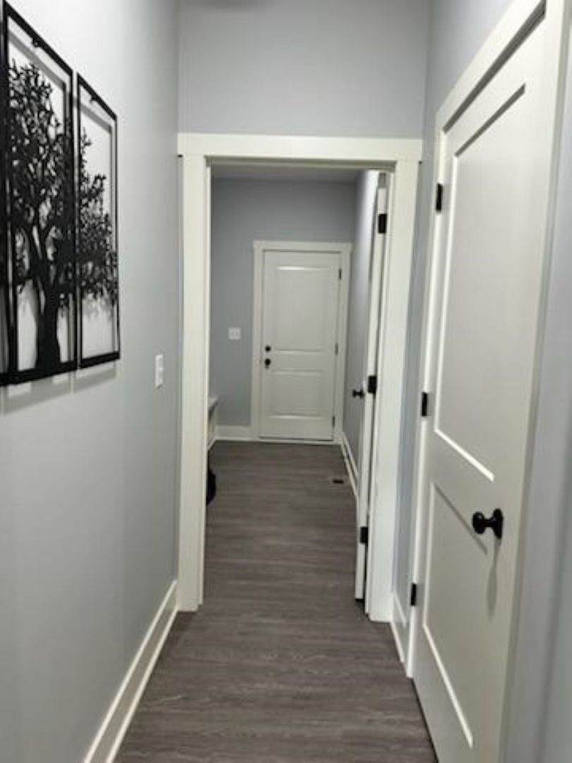 634 Anjali Court, Unit R Sycamore, IL 60178 - Photo 17 of 20 a view of a hallway with wooden floor and a hallway