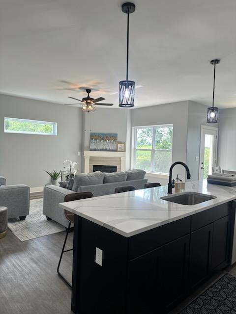 634 Anjali Court, Unit R Sycamore, IL 60178 - Photo 5 of 20 a kitchen with a sink a counter space and dining table